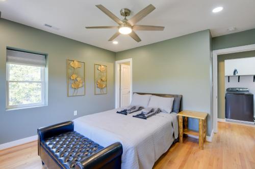 a bedroom with a bed and a ceiling fan at 8 Mi to DC Cheverly Apt with Easy Metro Access in Cheverly