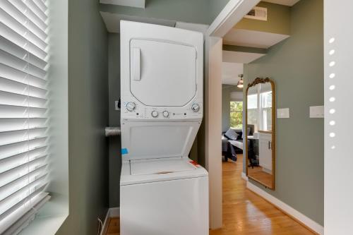 a washer and dryer in a room with a hallway at Commuters Dream! Cheverly Studio half Mi to Metro in Cheverly