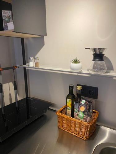 a basket sitting on a kitchen counter with a sink at Casa Soden, Artful living just outside the city in Bad Soden am Taunus