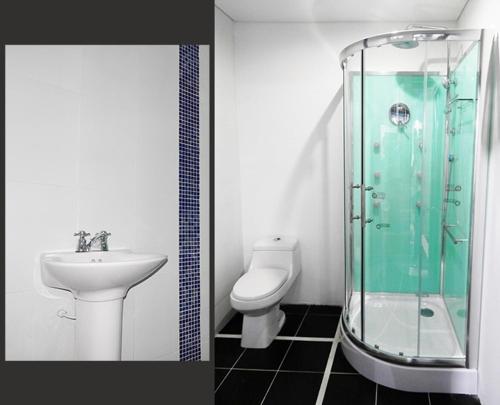 a bathroom with a sink and a toilet and a shower at Villa campestre en conjunto residencial in Arbeláez