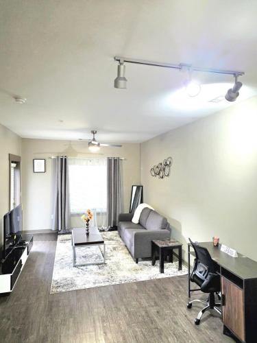 a living room with a couch and a table at Gorgeous Uptown Apartment with Pool in Charlotte