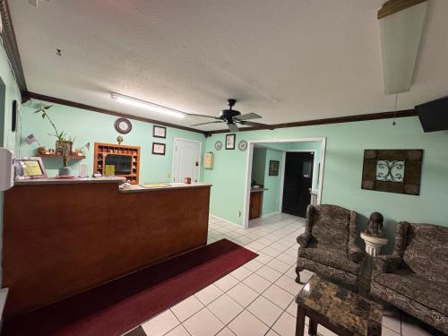 a lobby with a pharmacyacistacistacistacist at Claremore Motor Inn in Claremore
