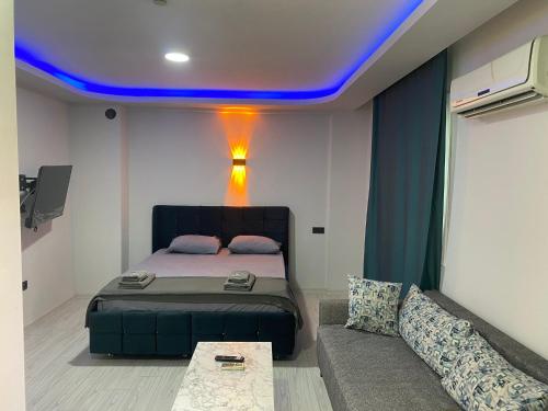 En eller flere senge i et værelse på Damla Apart Otel