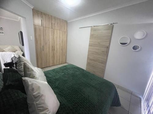 a bedroom with a bed and a sliding door at The Gather Inn Bethlehem in Bethlehem