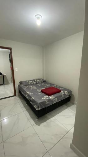 Ένα ή περισσότερα κρεβάτια σε δωμάτιο στο Acomodação aconchegante e com linda vista