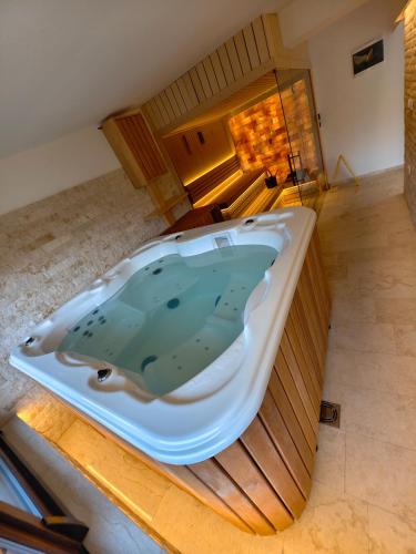 an overhead view of a bath tub in a room at Planinska kuca Popovic 3 in Ljuboš