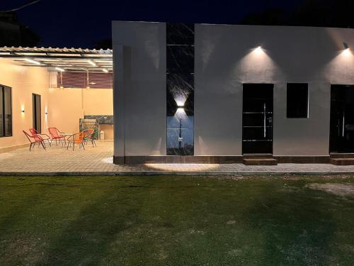 a house with a patio with tables and chairs at Two-bedroom apartment CDE - Area 4 - Close to everything in Ciudad del Este