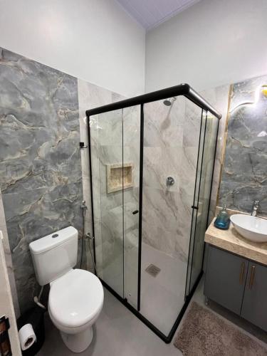 a bathroom with a shower and a toilet and a sink at Dos habitaciones - apartment CDE - Area 4 in Ciudad del Este