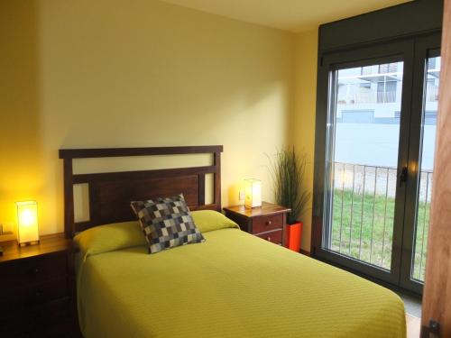 En eller flere senge i et værelse på Apartamentos Ababides Playa