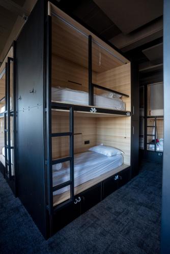 Säng eller sängar i ett rum på Nordic Hostel