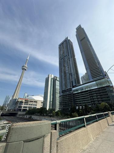a group of tall buildings in a city at Entire Luxe Condo in Downtown Toronto in Toronto