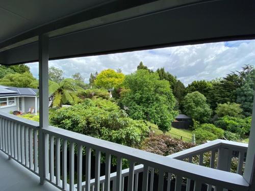 a view from the balcony of a house at Treetop studio apartment in Hamilton