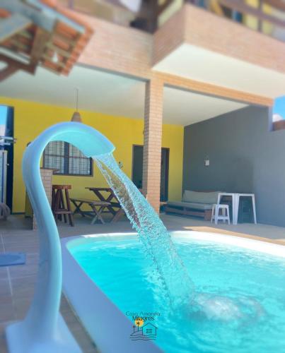 a water slide in a swimming pool at Casa Amarela Milagres in São Miguel dos Milagres