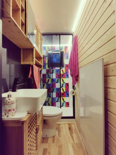 a bathroom with a sink and a toilet at Floating Downtown Apartment in Gothenburg