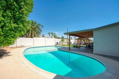 a swimming pool in the middle of a yard at Beautiful Pool Home By Old Town, Sleep 14! in Scottsdale