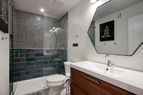 a bathroom with a toilet and a sink and a shower at Dreamy Pool Home By Old Town, Sleep 14! in Scottsdale