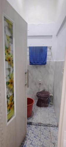 a bathroom with a toilet in a room at Homestay Permata Cirebon in Ciperna