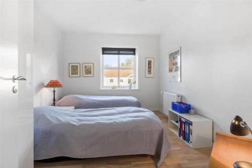 a bedroom with two beds and a window at HA259-Hals-Portlandsvej-97-B-1-mf in Hals