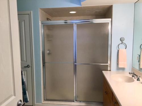 a bathroom with a shower and a sink at No Chris in Waretown