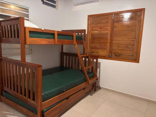 a couple of bunk beds in a room at Cantinho Aconchegante in Macapá