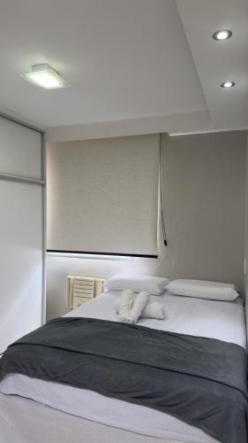 En eller flere senge i et værelse på Apartamento COP 30