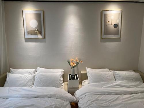 Postel nebo postele na pokoji v ubytování Only Yoo Stay