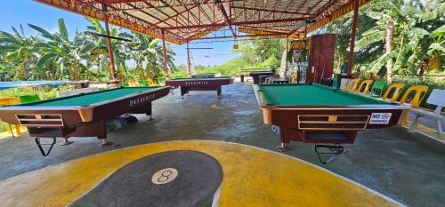 a group of pool tables in a room at Banana Bar in San Juan