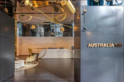 a lobby of an australia building with a table and a chair at 3415 - 2BR Luxury Suite #Free Car Parking# Retreat Near Crown in Melbourne