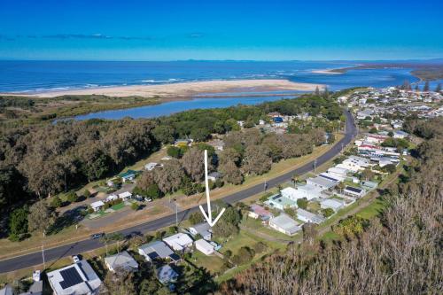 an aerial view of a small town next to the ocean at Harrington Holiday House in Harrington