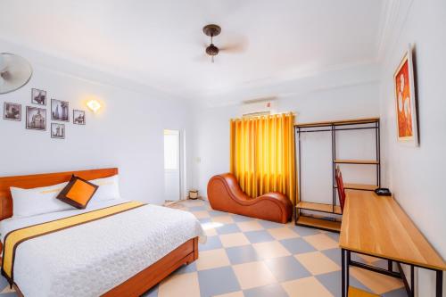 Postel nebo postele na pokoji v ubytování Thắng Lợi Hotel