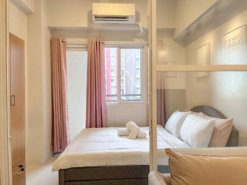 Postel nebo postele na pokoji v ubytování Greenthumbs Staycation