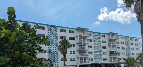 a large white building with blue tiles on it at Oceanfront 2Br-2B in Satellite Beach - Ocean Views in Satellite Beach