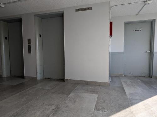 an empty room with white walls and two doors at Oceanfront 2Br-2B in Satellite Beach - Ocean Views in Satellite Beach