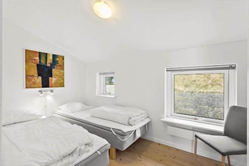a room with two beds and a window at FY342-Martofte-Fynshovedvej-854-H in Martofte