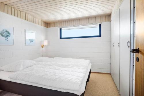 a bedroom with a bed in a room with a window at FY290-Faaborg-Egholmvej-14 in Faaborg