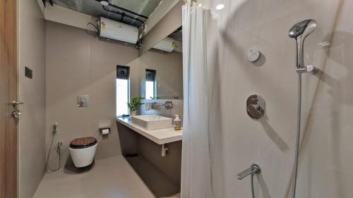a bathroom with a shower and a sink at ZERO9 farmPAD - Private Eco Retreat, Karjat in Karjat