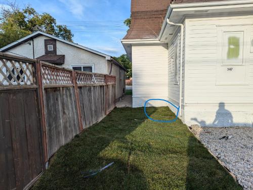 a yard with a fence next to a house at 347 Des Meurons Street Unit A and Unit B in Bélanger