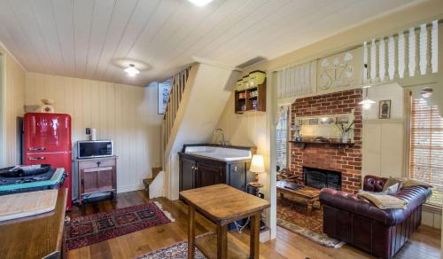 a living room with a couch and a fireplace at Olinda Stay in Olinda