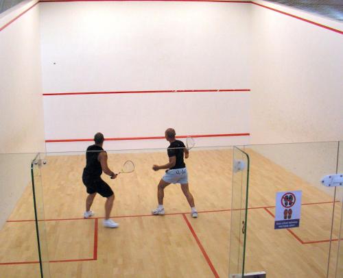 two men playing a game of volley ball in a gym at Športové a relaxačné centrum - ŠRC in Stará Ľubovňa
