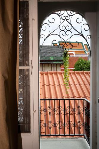 an open door with a view of a roof at Bangkok Neighborhouse in Bangkok