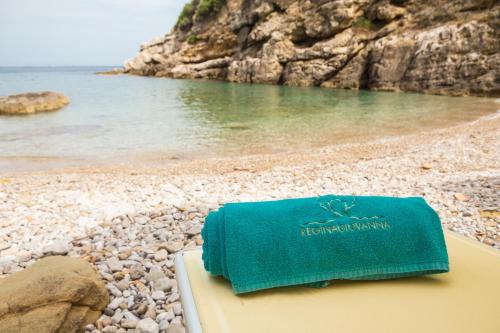 a towel sitting on top of a beach at Relais Regina Giovanna in Sorrento