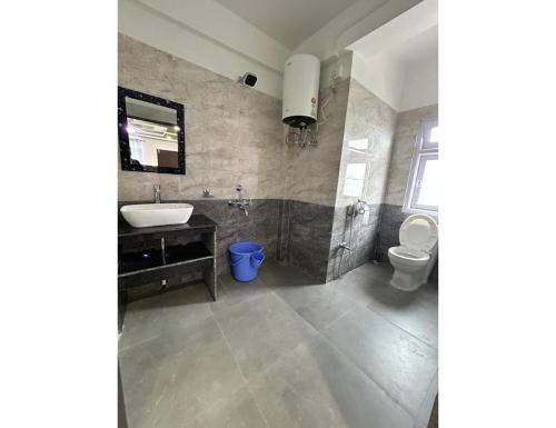 a bathroom with a sink and a toilet at Ana SonamTsomu, Tawang in Tawang