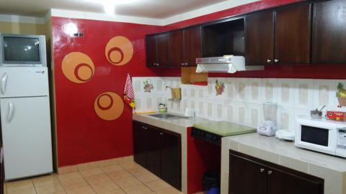Una cocina o cocineta en Otavalo Apartamentos Rocsan