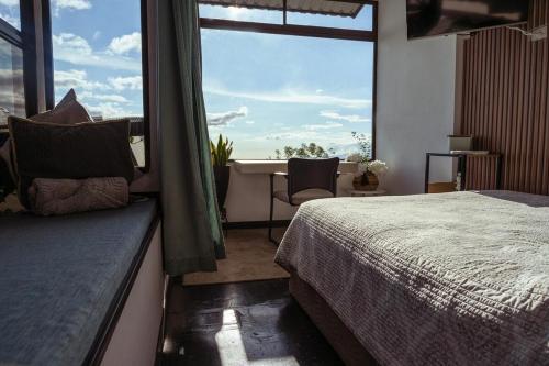 Postel nebo postele na pokoji v ubytování Dream Homes Vacaciones Heredia - 8 miles Airport