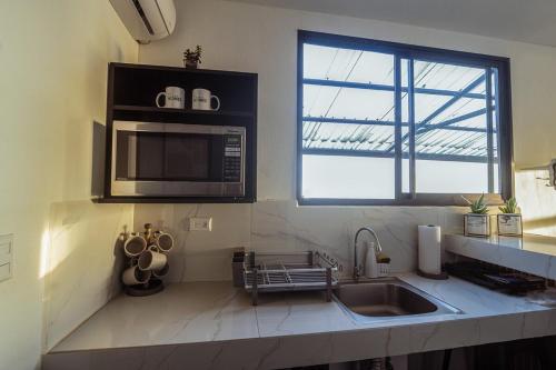 Kuchyň nebo kuchyňský kout v ubytování Dream Homes Vacaciones Heredia - 8 miles Airport