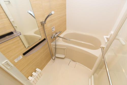 a small bathroom with a sink and a toilet at -シーフォルム京急蒲田-Entire Unit in Tokyo