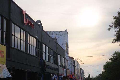 a building with windows on the side of a street at T Hotel Anggerik in Alor Setar