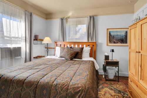 a bedroom with a large bed and a window at Northgate Station in Seattle