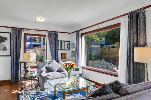 a living room with a couch and a table at Northgate Station in Seattle