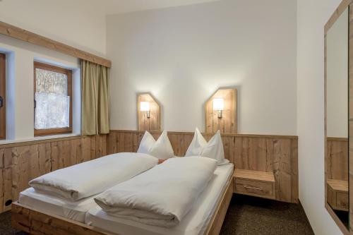 Postel nebo postele na pokoji v ubytování Ferienwohnungen Haus Daheim